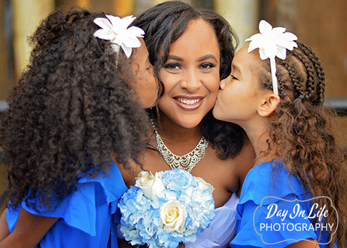 Bride kissed by daughters at wedding in Downtown Indianapolis.